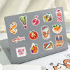 A laptop displaying a collection of colorful Mediterranean aesthetic graffiti stickers on its surface.
