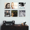 A display shelf featuring acrylic vinyl records with movie titles like Jurassic Park and Blade Runner.