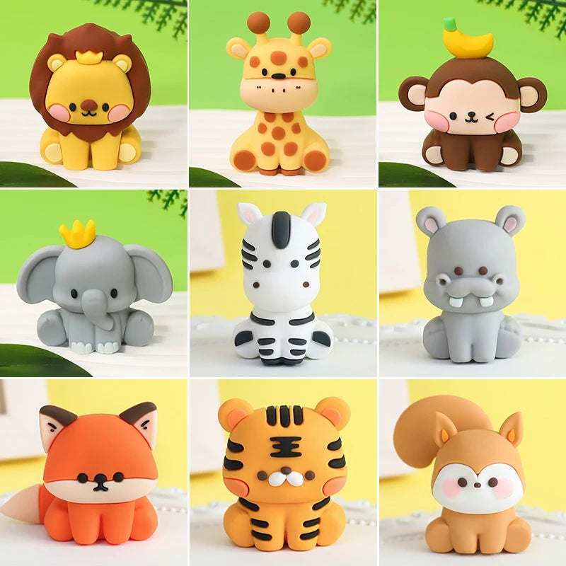 A collection of cute jungle animal cake toppers featuring lions, giraffes, monkeys, elephants, zebras, and tigers.