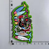 A collection of wooden fridge magnets featuring colorful fish and a turkey, with the word Portugal written below.