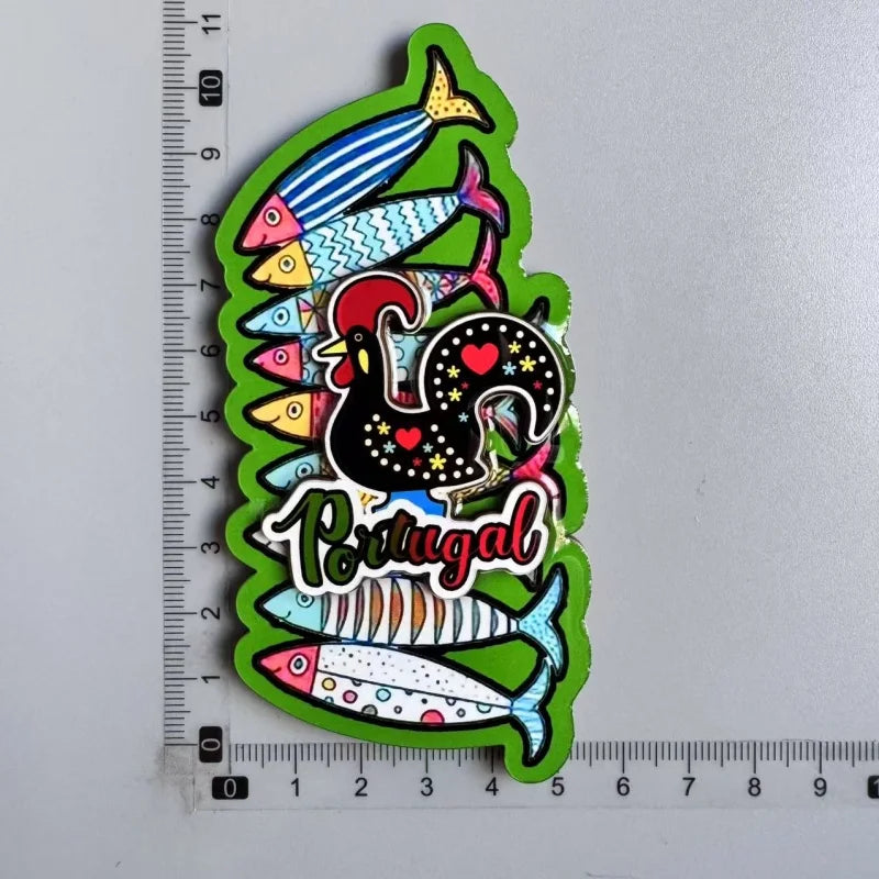 A collection of wooden fridge magnets featuring colorful fish and a turkey, with the word Portugal written below.