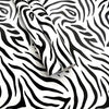 Rolls of zebra print self-adhesive peel and stick wallpaper on a white background.
