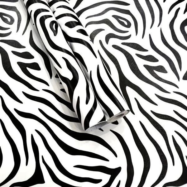 Rolls of zebra print self-adhesive peel and stick wallpaper on a white background.