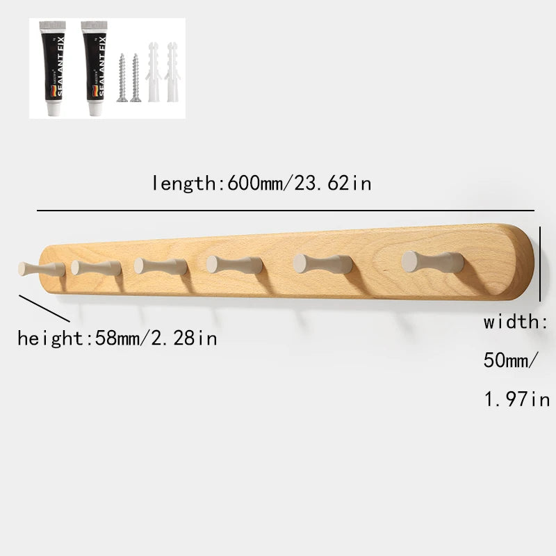 Solid beech wood wall hook rack with four wooden hooks shown in a close-up view.