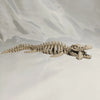 A 3D printed dinosaur skeleton figurine featuring a T-Rex and Mosasaurus collectible.