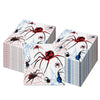 A stack of Halloween skeleton and spider paper napkins featuring red, black, and blue spiders on a white background.