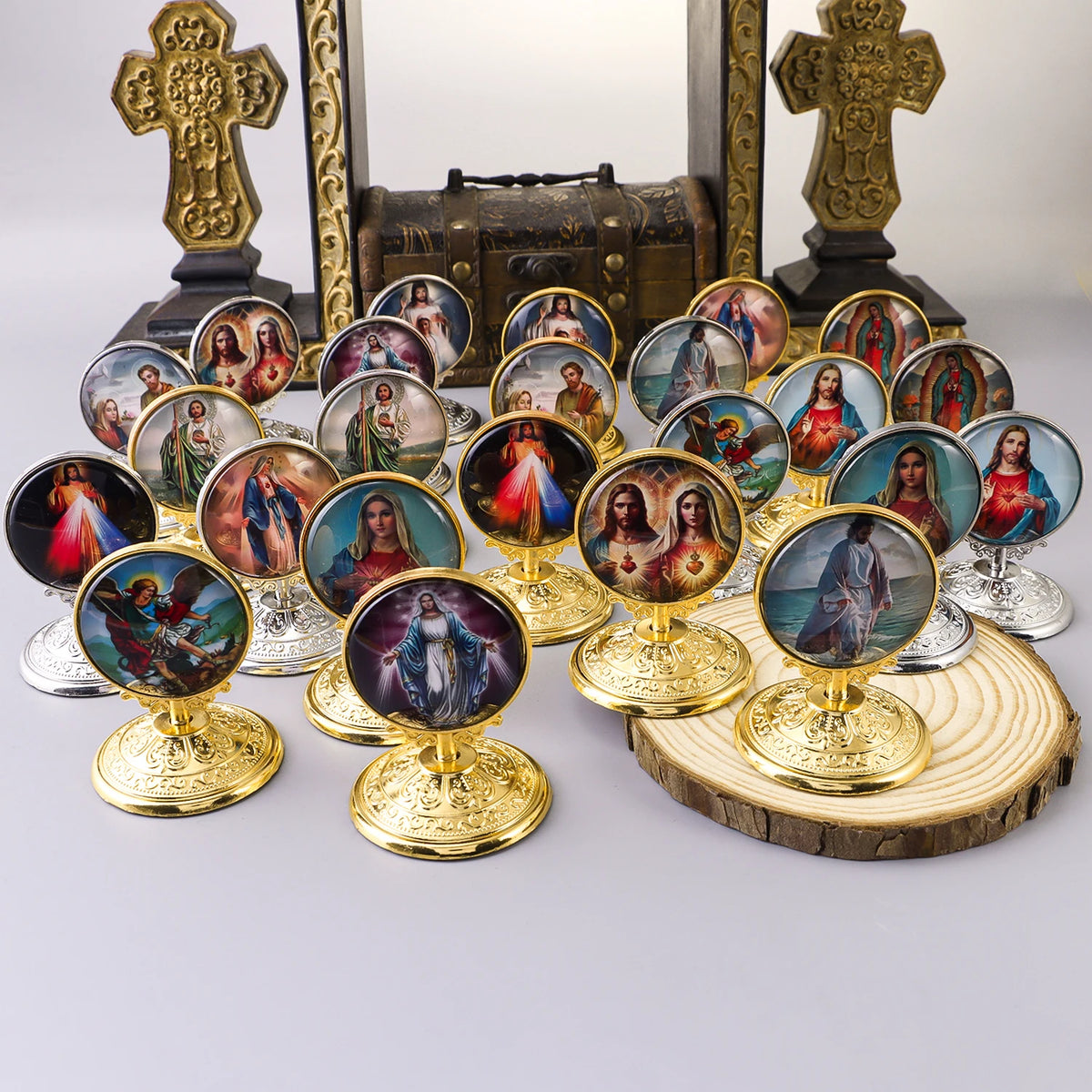 A collection of retro Catholic tabletop ornaments featuring religious figures in gilded frames and various colors.