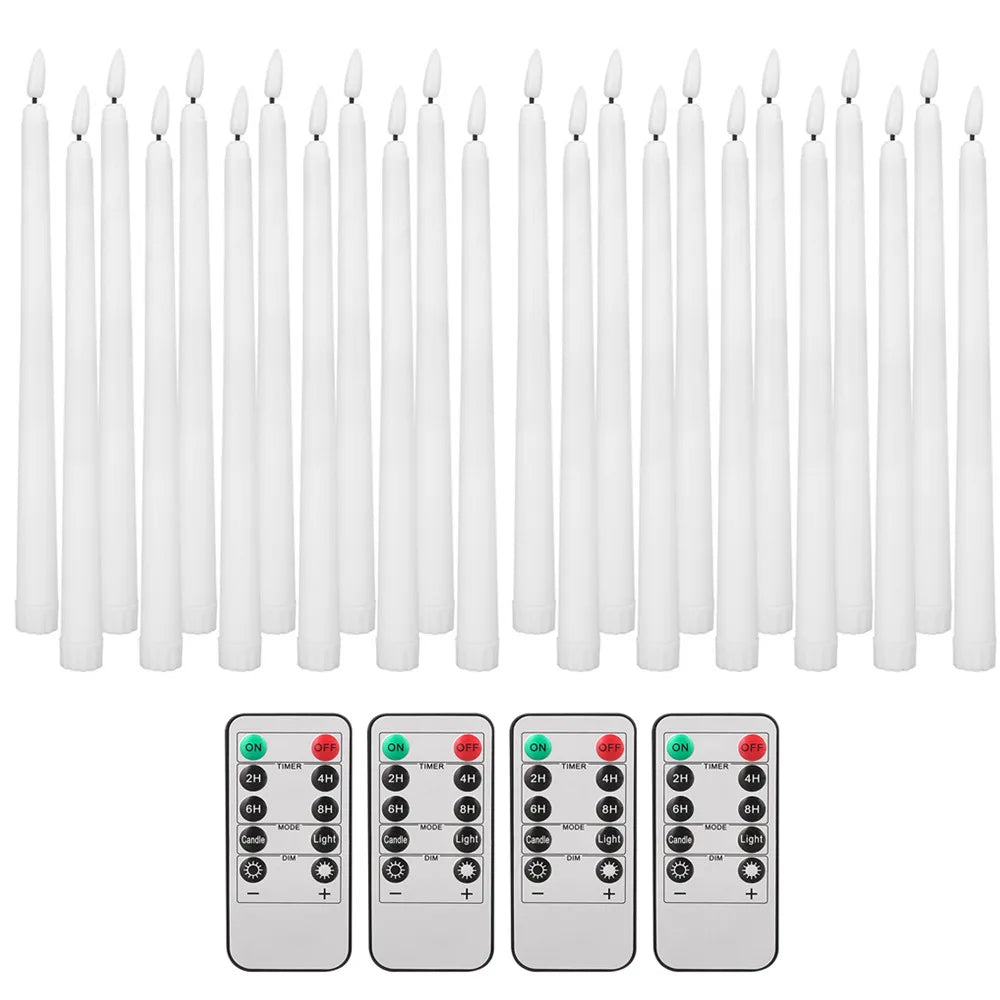 A set of white flameless taper candles with remote controls and timers shown alongside battery packs.