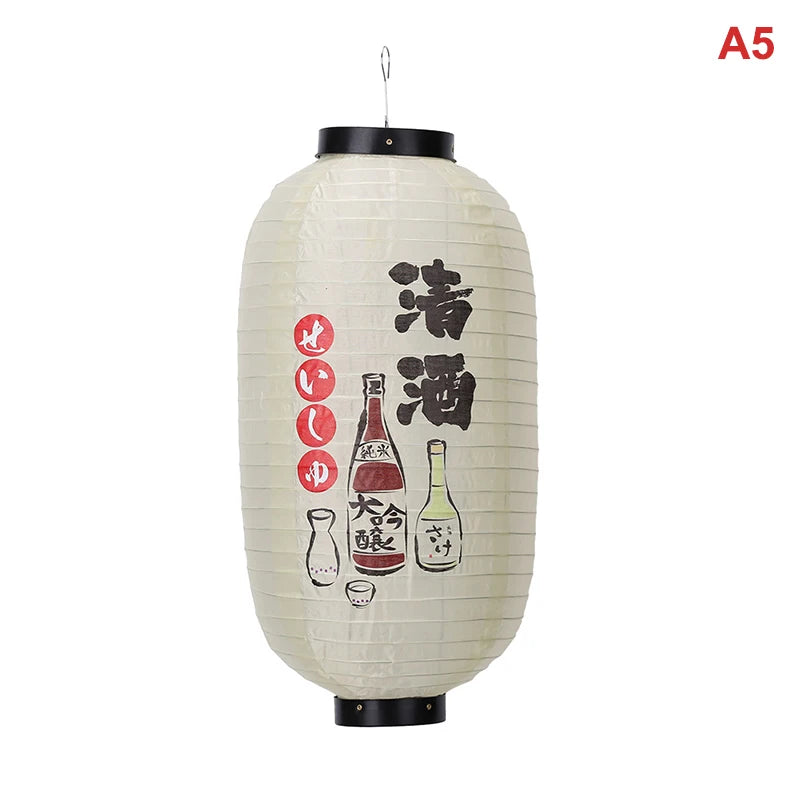 A large, cylindrical Japanese paper hanging lantern with black accents and Japanese characters.