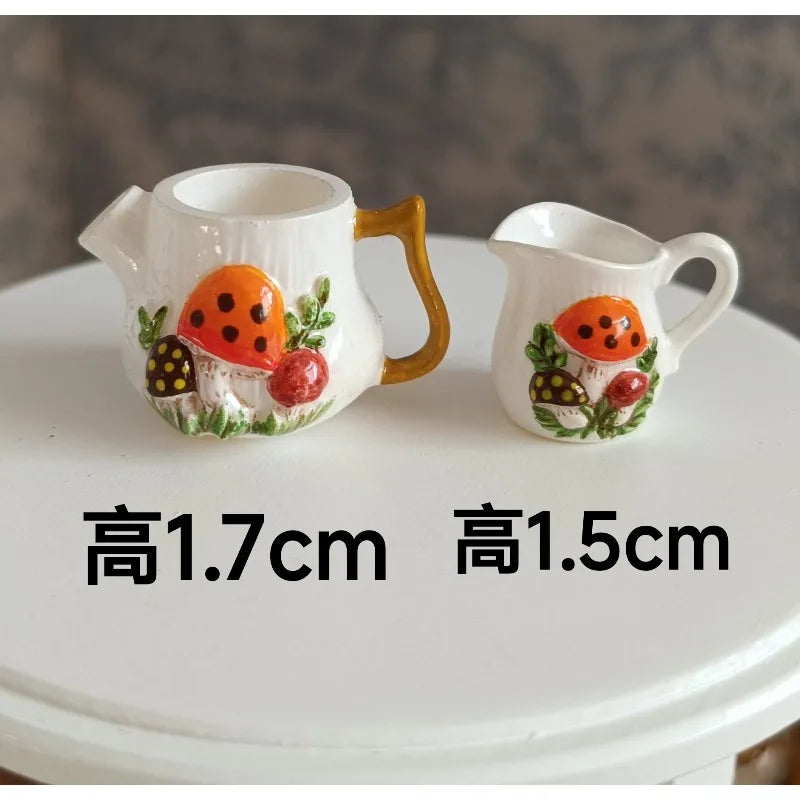 A set of two handcrafted ceramic mugs or cups with painted mushrooms used as decoration.