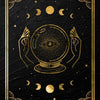 Gold-framed mystical tarot art featuring an eye within a sphere surrounded by celestial bodies and crescent moons on a black 