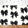 Black satin bow tie banners hanging against a white background