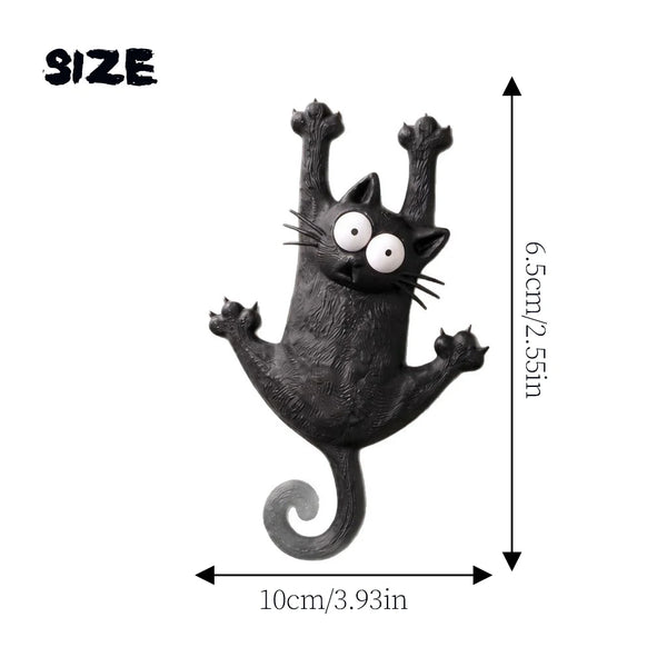 A black magnetic cat fridge decal with whiskers and a curled tail.