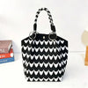 Black and white patterned jacquard knitted shoulder bag with black leather handles