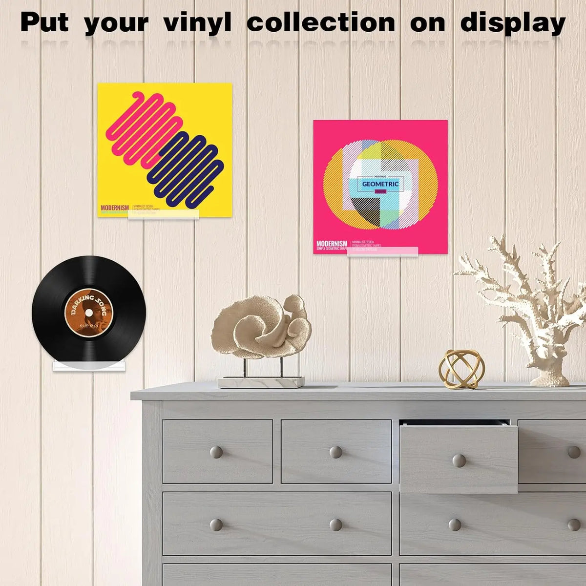 Four clear acrylic floating shelves for displaying vinyl records and albums on a wooden cabinet.