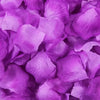 A close-up of vibrant purple silk rose petals for weddings and special events.