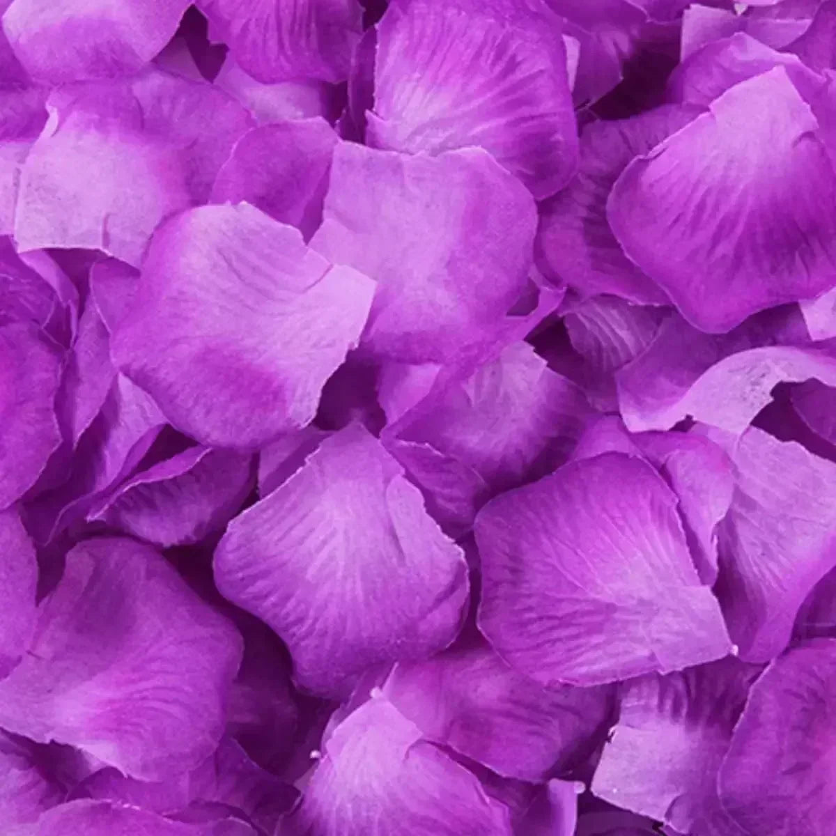 A close-up of vibrant purple silk rose petals for weddings and special events.