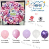 A pink balloon garland arch decoration featuring various shades of pink and purple balloons for a birthday celebration.