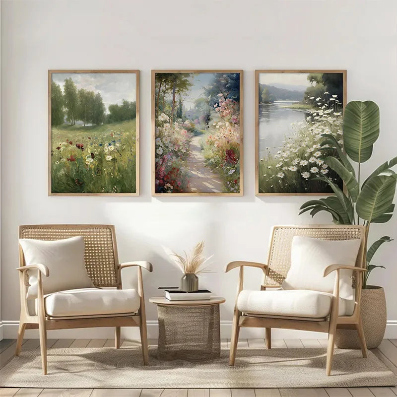 A set of three framed canvas paintings depicting spring flowers and landscapes displayed on a white wall.