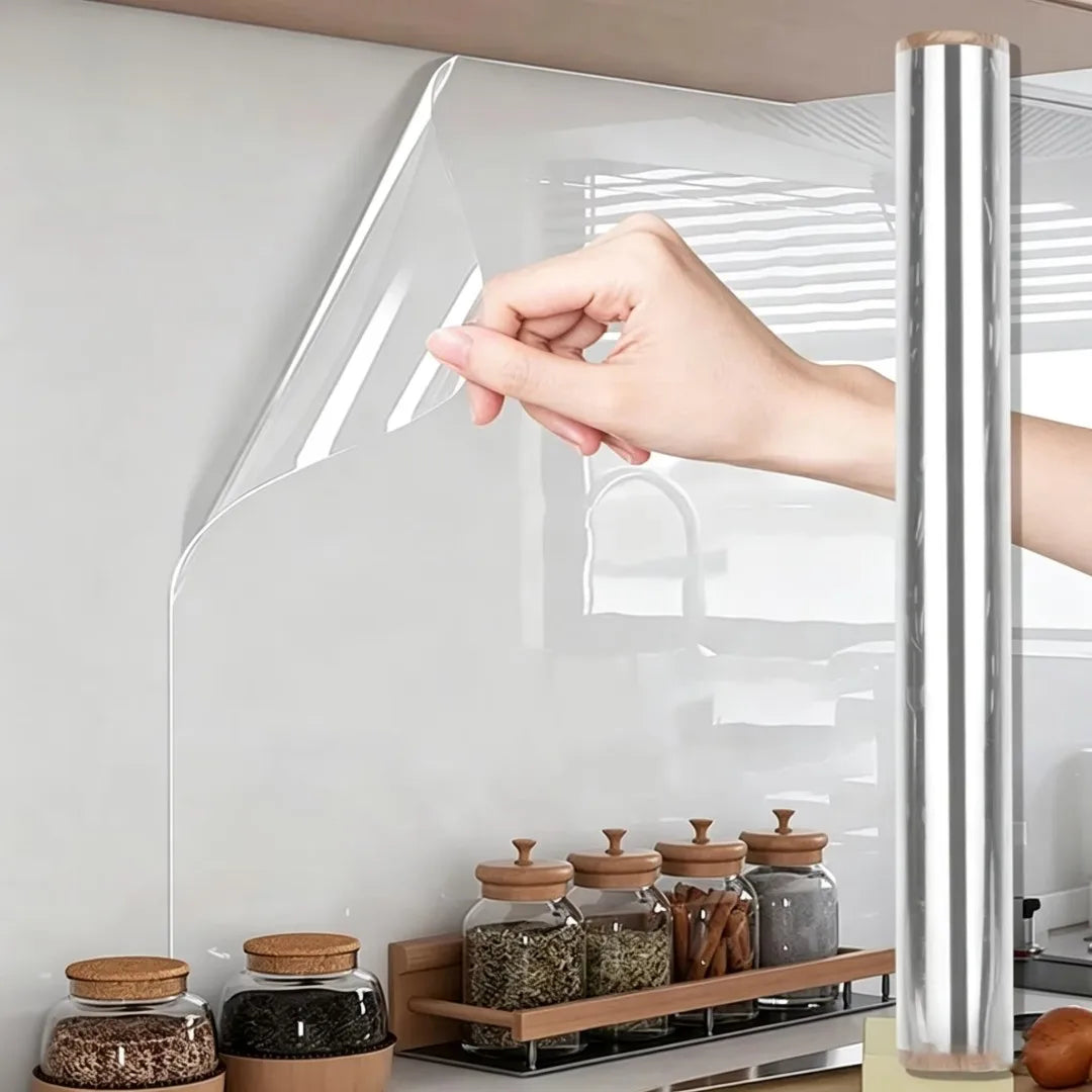 A hand is touching a clear window film applied to a glass surface for privacy and decoration.