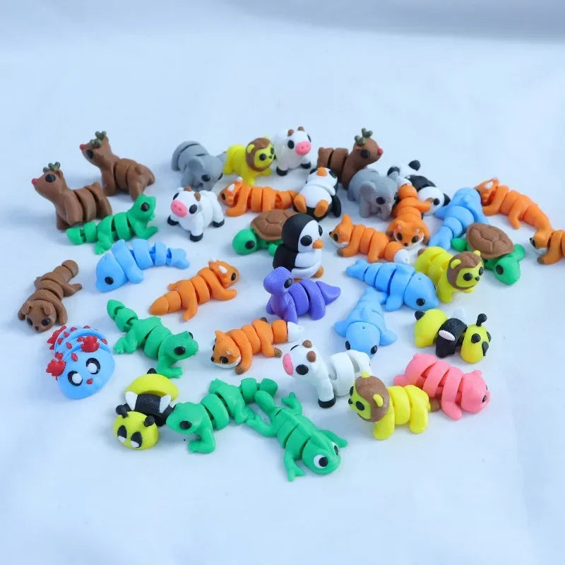A collection of colorful 3D printed cartoon animal figurines featuring various animals like deer, cats, and bears.