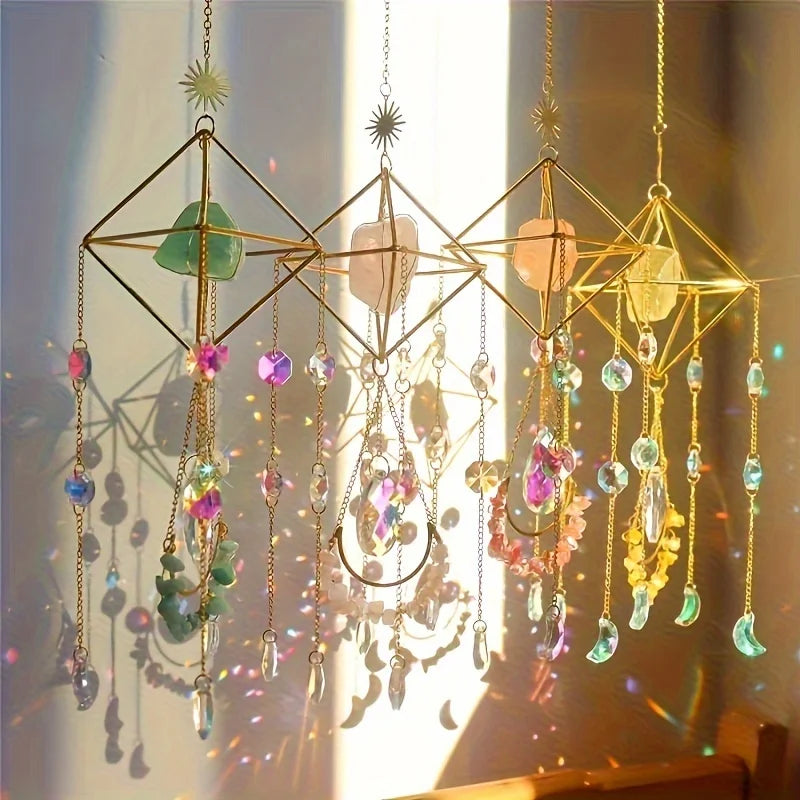 A hanging crystal sun catcher with various colored glass and quartz elements catching sunlight.