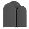 Three gray spandex fitted wedding arch covers standing upright.