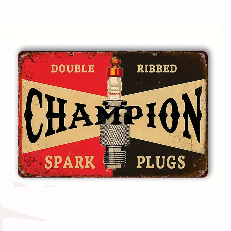 Vintage metal tin sign featuring the word CHAMPION with double ribbed spark plugs text