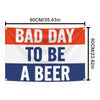 Bannière en tissu rectangulaire à rayures rouges, blanches et bleues avec le texte BAD DAY TO BE A BEER