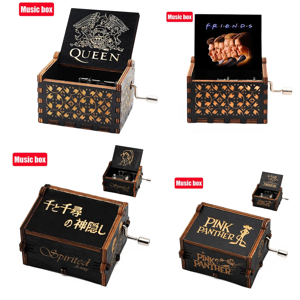 A collection of carved wooden music boxes featuring various band and artist themes like Queen, Friends, and Pink Panther.