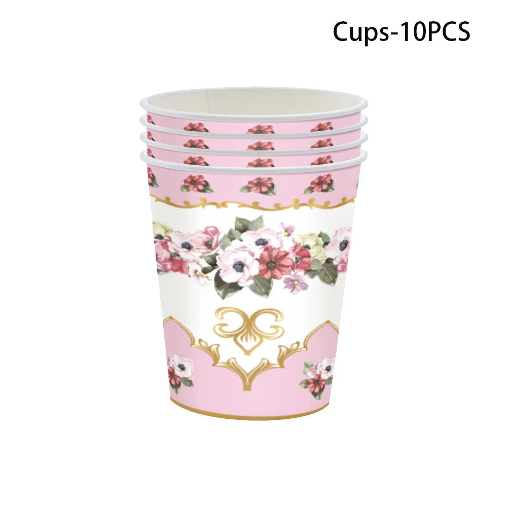A set of 10 pink cups with vintage floral patterns for a party table.
