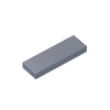 A rectangular building brick tile in a solid gray color.