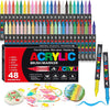 A set of 48 acrylic paint markers with various colors and brush tips displayed in a box alongside paint splatters and artwork