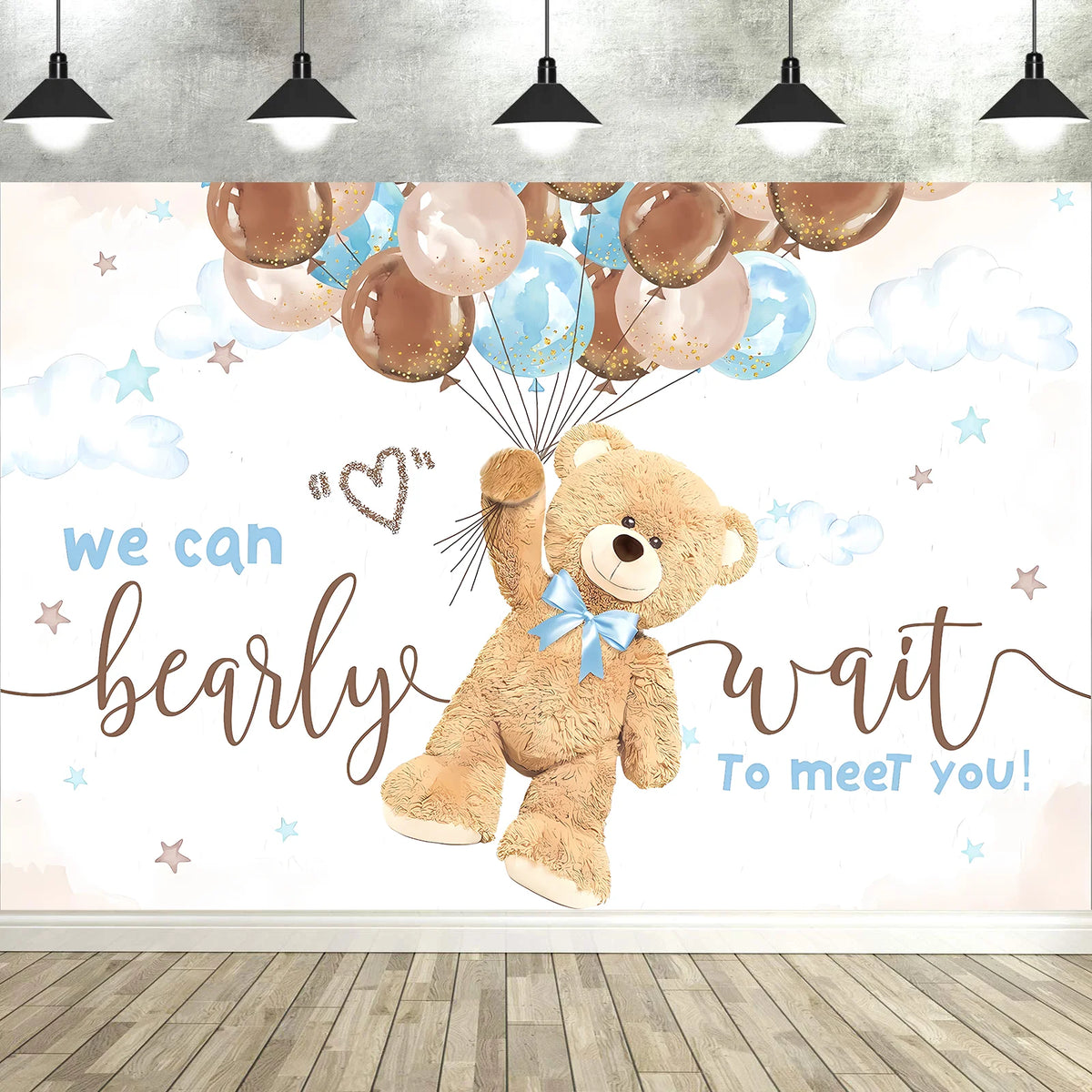 A photo backdrop featuring a cute cartoon bear, balloons, and stars for a baby shower or party decoration.