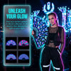 A woman holds an iridescent UV glow folding rave hand fan against a bright, neon background.