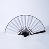An illuminated folding hand fan with black and clear blades showing light accents.