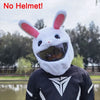 A person wearing a white cartoon rabbit plush helmet cover on a full-face motorcycle helmet.
