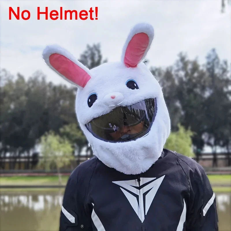 A person wearing a white cartoon rabbit plush helmet cover on a full-face motorcycle helmet.
