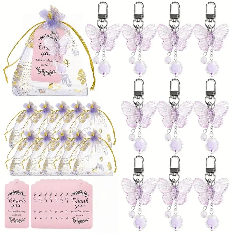 A set of 36 pink butterfly pendant keychains featuring iridescent wings and purple accents.