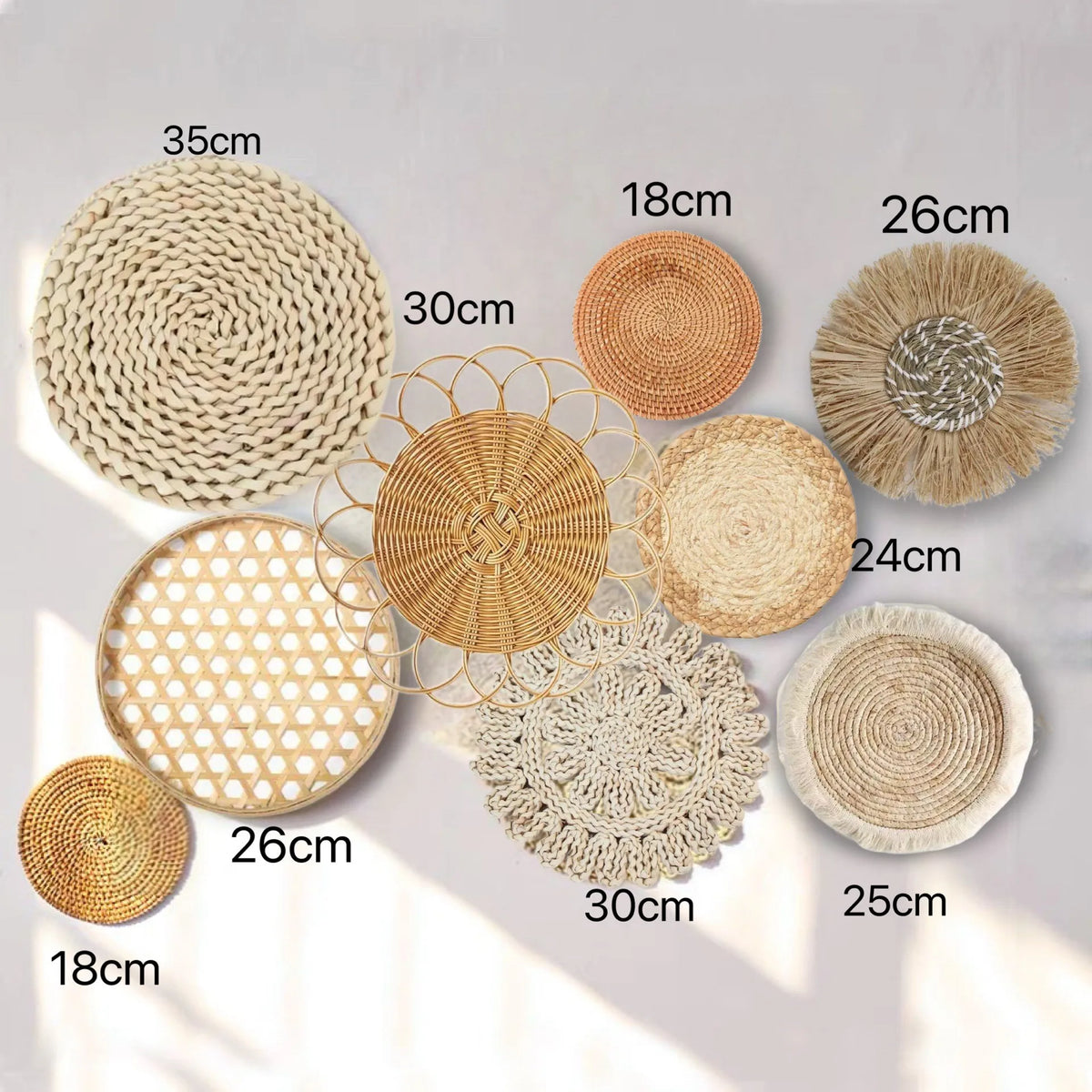 A collection of round boho straw wall hangings in various sizes and shades, including natural beige, tan, and light brown.