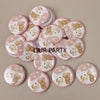 A collection of round pin badges featuring cartoon bears for gender reveal and baby shower parties