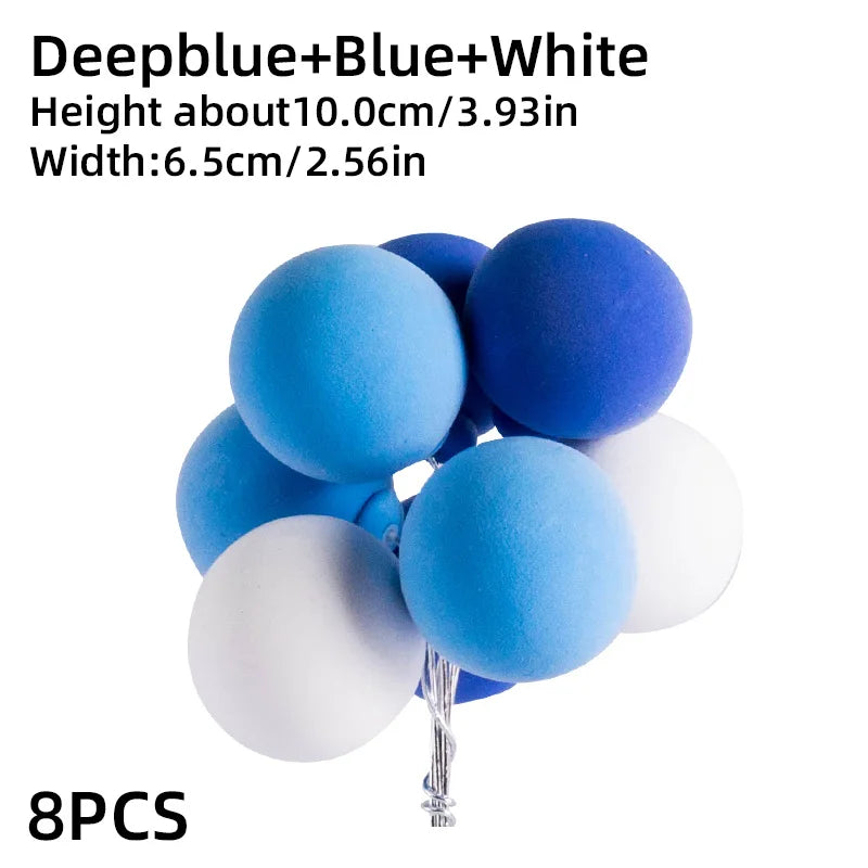 Eight blue and white spherical cake toppers for birthday parties