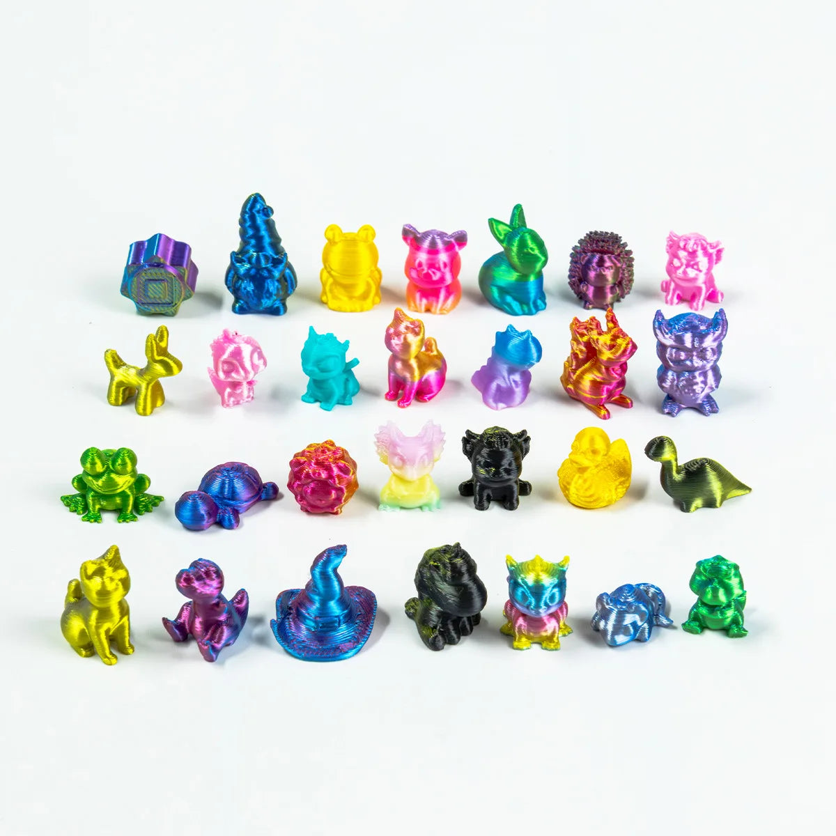 A collection of assorted mini animal figurines in various bright colors arranged in a line.