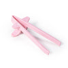 Pink reusable wheat straw finger chopsticks shown against a white background.