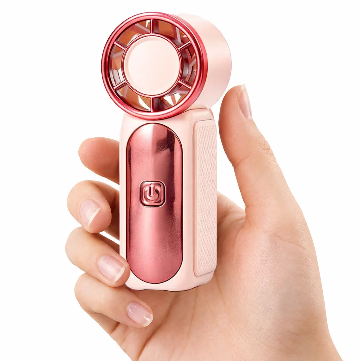 A hand holds a pink portable handheld cooling fan with a clear circular grille.
