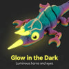 A glow in the dark 3D printed chameleon fidget toy with luminous horns and eyes
