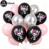 A pack of 15 black and pink balloons featuring a boo skull design for a Halloween party.