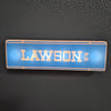 A rectangular blue LED sign with the word LAWSON in gold lettering and Japanese characters on a dark surface.