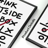 A close-up of a black framed canvas print with motivational text and design elements on a white background.