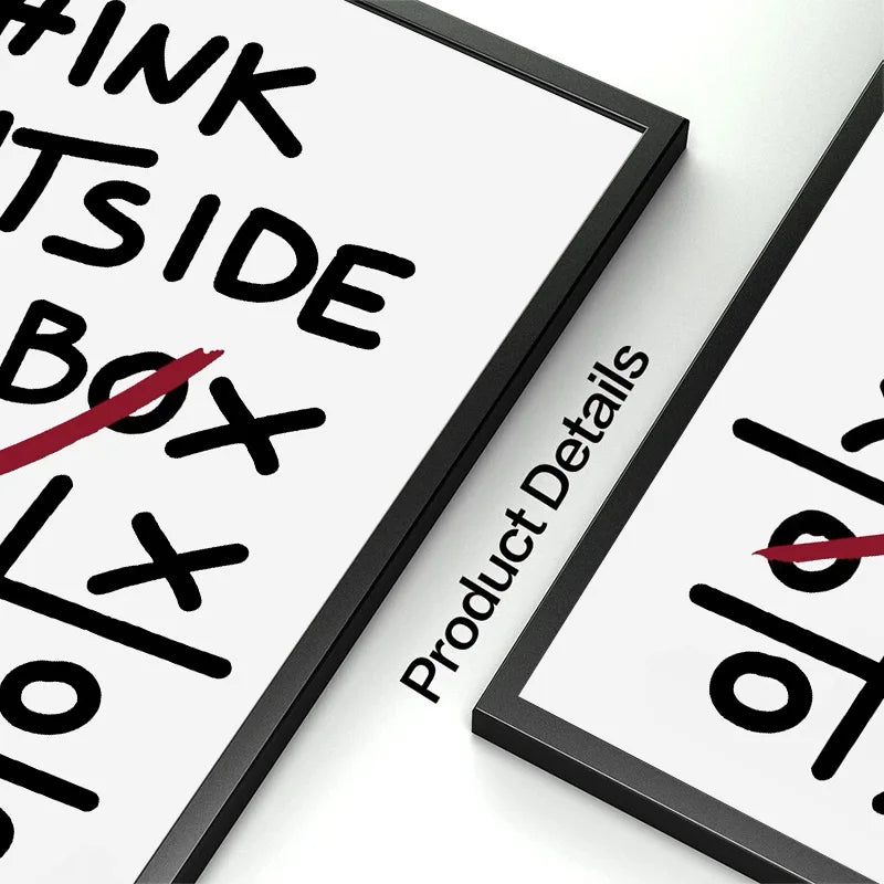 A close-up of a black framed canvas print with motivational text and design elements on a white background.